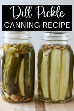 two jars filled with pickles sitting on top of a wooden table