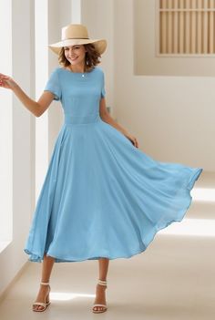 This chiffon dress is a vision of grace and elegance, presented in a serene sky blue that evokes the tranquility of a clear day.  The lightweight chiffon material adds an airy and ethereal quality to the dress, making it an ideal choice for occasions that call for a blend of comfort and refined style. DETAILS * Made of Chiffon fabric, fully chiffon liner * Midi dress * Without pockets * Fitted waist to show off your curves * Concealed Back zip closure  * Perfect for summer * Wash by hand or mach Fitted Chiffon A-line Dress, Flowy Chiffon Short Sleeve Dress For Evening, Solid Color Chiffon Empire Waist Dress, Flowy Short Sleeve Chiffon Dress For Formal Occasions, Fitted A-line Chiffon Dress, Flowy Chiffon Dress With Short Sleeves For Formal Occasions, Blue Chiffon Midi Dress For Wedding, Flowy A-line Chiffon Dress, Flowy Knee-length Chiffon Wedding Dress