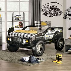 a black and white monster truck bed in a bedroom