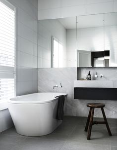 an all white bathroom with the words how to decorate your bathroom