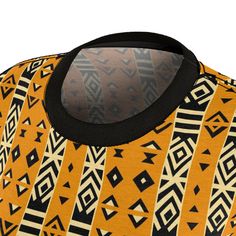 Unleash your creative spirit with our Saharan Geometric Elegance Tee, a classic yet contemporary piece that transforms traditional African mud cloth patterns into wearable art. This high-quality all-over print (AOP) t-shirt captures the intricate geometric designs and earthy ambiance of the Sahara, bringing a piece of heritage to your everyday wardrobe.Crafted from 100% polyester, this light fabric tee offers a comfortable, regular fit without compromising on durability. The tagless feature ensu Traditional Black Crew Neck Top, Traditional Crew Neck Top For Festivals, Traditional Brown Tops For Festivals, Traditional Printed Black Tops, Traditional Brown Top For Festivals, Traditional Black Printed Top, Traditional Batik Print Tops For Festival, Traditional Printed Yellow Tops, Traditional Brown Printed Top