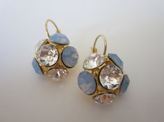 Amazing gold plated earrings placed with Swarovski Crystal and Air Blue Opal Chaton rhinestone.  These stunning earrings will be the perfect completion for a glow and unforgettable look! Blue Opal