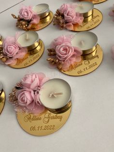 wedding favors with candles and flowers on them for guests to use as place cards or centerpieces