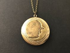 "Celestial Quarter Moon Locket Necklace.... I used a round antique brass floral brass locket and added an antique brass plated stars and quarter moon brass stamping to the center. This heavenly locket is suspended from an antique brass chain with soldered links. The chain is non tarnish and closes with a lobster claw clasp (pictured in the first photo). You will LOVE wearing this locket! Locket - 1.26\" in diameter OR (32mm) Interior Photo Area -24mm You will receive this beautiful celestial loc Bohemian Gold Brass Locket Necklace, Handmade Brass Locket Necklace For Wedding, Antique Round Necklace With Moon Charm, Victorian Crescent Jewelry As Gift, Bohemian Antique Gold Brass Locket Necklace, Victorian Crescent Jewelry For Gifts, Victorian Crescent Jewelry Gift, Vintage Brass Jewelry With Moon Charm, Handmade Brass Locket Necklace For Vintage Collection