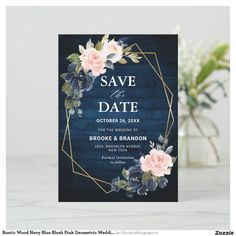 save the date card with pink roses and greenery on a blue wooden background in front of a vase