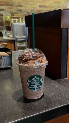 a starbucks drink sitting on top of a counter