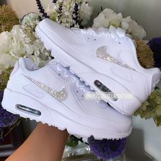 Your Custom Unique White Sparkly Crystal Nike Air Max 90 shoes are fully custom hand crystallised and guaranteed to bring some sparkly BLING to your life! These Nike Air Max 90 Trainers are 100% unique with no two pairs the same. Super comfortable shoes! 𝕀𝕄ℙℝ𝔼𝕊𝕊 𝔼𝕍𝔼ℝ𝕐𝕆ℕ𝔼 with these custom Crystalized Air Max Kicks today! Size: Please contact us if unsure on what size you need.  UK 2 / EU 34 / Girls 2.5Y UK 2.5 / EU 35 / Girls 3Y UK 3 / EU 35.5 / Girls 3.5Y UK 3.5 / EU 36 / Girls 4Y / Bride Sneakers, Nike Trainer, Swarovski Nike, Nike Air Max 90s, All White Sneakers, Air Max 90 Women, Air Max 90s, Ribbon Laces, Air Max 90 Premium