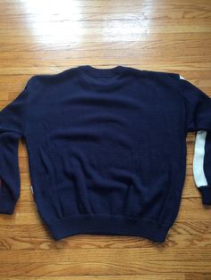 If you love the USA, this is the perfect sweater for your life. It is in amazing condition and is super soft and comfortable. It will be perfect for cold weather or just for a cooler spring night. There are no rips, holes or stains. Measurements: Pit to pit: 23 1/2 inches Collar to bottom front: 22 inches Collar to bottom back: 24 inches Sleeve Length (from collar): 29 1/2 inches Size on tag: no tag (measures like XL) Sporty Long Sleeve Knit Sweater, Oversized Cotton Polo Sweater For Winter, Vintage Long Sleeve Soft Knit Sweater, Vintage Oversized Sweater With Ribbed Cuffs, 90s Style Cotton Sweater For Fall, Retro Knit Tops With Ribbed Cuffs, 90s Relaxed Fit Cotton Sweater, 90s Style Relaxed Fit Cotton Sweater, 90s Style Relaxed Fit Fall Sweater