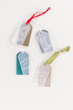 three tags that say, let it be merry and have ribbons tied around the tags