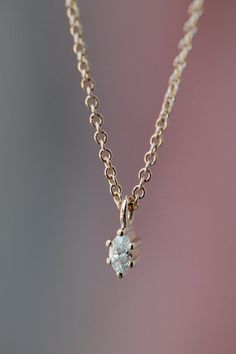 A perfectly pointed diamond drop. Available in 14k white, yellow, and rose gold Recycled Marquise Diamond: 3.3 x 1.8mm, ~0.043 carats, GH Si1 Fine 16" cable chain Made in Toronto, Canada Each piece is made-to-order with care and special attention to detail. Please allow 3-5 weeks for items to ship. Elegant 14k Gold Jewelry With Diamond Eyes, Dainty Marquise Rose Gold Jewelry, Minimalist Teardrop Single Diamond Jewelry, Delicate Diamond Teardrop Pendant Jewelry, Marquise White Gold Jewelry With Single Cut Diamonds, Dainty Marquise Cut Rose Gold Jewelry, Delicate Oval Single Diamond Jewelry, Minimalist Teardrop Jewelry With Brilliant Cut, Dainty 14k Gold Jewelry With Diamond Eyes