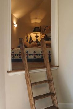 a wooden ladder leaning up against the wall