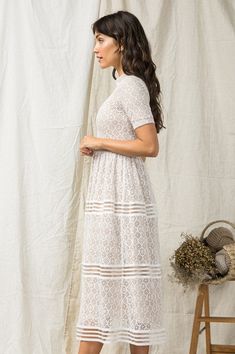 Meet the dress that looks good on everyone! Ivory Crochet Lace Trim Dress Ivory Lace Crochet Over Beige Lining Elastic Banded Waist Off White Lace Dress For Garden Party, Off-white Lace Dress For Garden Party, Off White Scalloped Lace Dress, Beige Lace Trim Midi Dress For Garden Party, White Maxi Length Dress With Lace Trim, Beige Midi Dress With Lace Trim For Garden Party, White Short Sleeve Maxi Dress With Lace Trim, White Lace Maxi Dress For Garden Party, Fitted Off White Dress With Lace Work