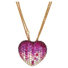 Pink sapphire and diamond heart pendant necklace, made in Italy Round-cut pink sapphires of approximately 2 carats, round-cut diamonds of 0.75 carat, 18 karat yellow gold double strands; marked 750 Size: pendant width 0.88 inch, length 0.75 inch; chain length 18.25 inches Total weight: 10.8 grams Diamond Heart Pendant Necklace, Pink Bling, Heart Pendant Diamond, All That Glitters, 2 Carat, Diamond Heart, Heart Pendant Necklace, Round Cut Diamond, Pink Sapphire