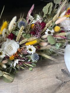 a bunch of flowers that are sitting on a table