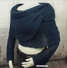 a close up of a mannequin's torso wearing a blue knitted sweater