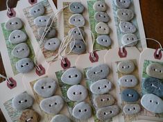 there are many different buttons on the table together, and one is made out of rocks