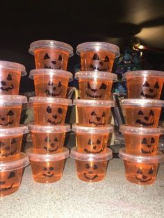 there are many plastic cups with faces on them