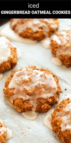 iced gingerbread oatmeal cookies with icing on a baking sheet in the background