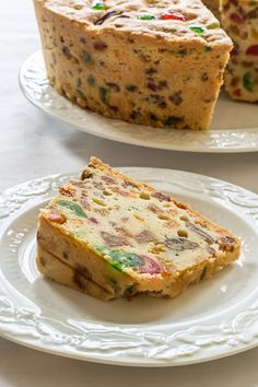 two white plates with slices of cake on them