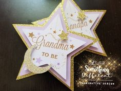 a pink and gold star ornament with the words grandma to be on it