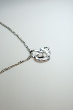 Presenting our Elegant Sterling Silver Linked Heart Necklace - a symbol of enduring love. This charming pendant is beautifully crafted, exuding timeless elegance and simplicity. It's an ideal romantic gift, perfect for anniversaries, Valentine's Day, or just to say 'I love you.' Adorn your neck with a touch of sentimentality. Romantic Jewelry, Necklace Love, Love Pendant, Romantic Jewellery, Grand Rapids Mi, Two Hearts, Romantic Gift, Grand Rapids, Sterling Silver Necklace