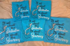 four blue tea towels with the words, it's not about the destination its about the journey