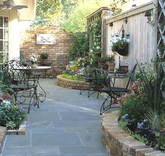 an outdoor patio area with chairs and tables