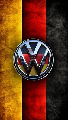 the vw emblem is shown in front of a german and yellow striped wallpaper