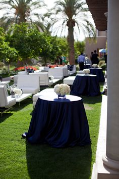 tables and chairs are set up on the lawn