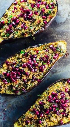 baked eggplant stuffed with pomegranate and herbs on a baking sheet