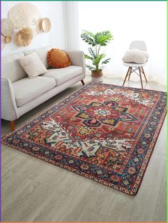 a living room with a couch, chair and rug