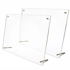 two clear acrylic boards with metal handles