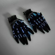 Illuminate all your outfits with our stunning mechanical hand gloves. Experience our latest robotic gloves — a pinnacle of innovation and artistry. Handcrafted with precision, these 3D printed gloves manifest a vision of a future where fashion meets the zenith of technology, representing the quintessential fusion between men and machines. Each glove is a testimony to craftsmanship, a piece that stands out in its unique luminous design, reminiscent of cyberpunk lights that illuminate Tokyo in the distant year of 2566. For enthusiasts who are captivated by cyberpunk culture, dystopian societies, and the allure of futurism, these "cyber hands" promise an experience unlike any other. When you adorn these robotic gloves, you don't just wear an accessory; you step into a narrative, into a world Cyberpunk Gauntlet, Cyberpunk Gloves, Cyberpunk Clothes Design, Cyberpunk Gear, Cyberpunk Boots, Blue Cyberpunk, Cyberpunk Masks, Cool Gloves, Cyberpunk Accessories