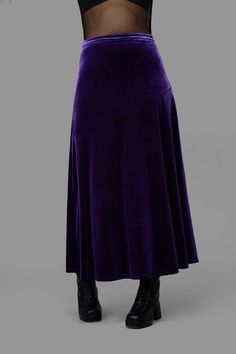 Elevate your evening attire with this stunning Formal Maxi Skirt by Black Friday. This elegant piece features a fitted waistband that hugs your silhouette beautifully, while the asymmetrical design line across the front adds a touch of modern sophistication. Crafted from luxurious stretch velvet, the draped fabric flows gracefully, creating an enchanting movement as you walk.With a convenient zip closure at the side seam, this maxi skirt is as practical as it is stylish. Fabric & Care:Material: 100% Polyester VelourCare Instructions:Cold Machine WashDo Not Bleach or SoakDo Not Wring or SpinDo Not Tumble DryCool Iron on Reverse if Required Purple Velvet Skirt Outfit, Formal Maxi Skirt, Whimsigoth Fashion, Alternative Fashion Indie, Avengers Dr, Whimsical Clothing, Whimsical Gothic, Kids Scrubs, Top Surgery