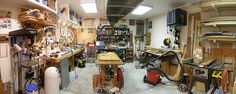 a room filled with lots of work tools and shelves full of clutter on the walls