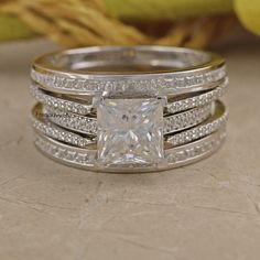 a princess cut diamond ring set with matching bands