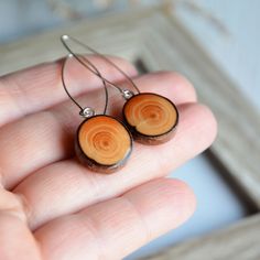 I made these long dangle earrings from sterling silver circles and natural wood. I found a beautiful tree branch in the forest and decided to give it a second life :) I cut the branch into slices, sanded and joined with sterling. Very woody earrings. Great gift made of wood, for her and for all nature lovers. These earrings are very light. Only one pair is available. The earrings are about 5 cm (2'') long and they are very light. You will receive this item carefully wrapped in wooden jewelry box Natural Wood Drop Earrings For Pierced Ears, Natural Wood Jewelry Gift, Handmade Round Natural Wood Jewelry, Natural Wood Drop Earrings, Brown Circular Earrings As Gift, Brown Circular Earrings For Gift, Brown Circular Earrings For Gifts, Brown Circular Jewelry Gift, Elegant Natural Wood Jewelry For Gift