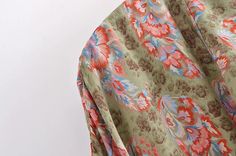 The Selina Floral Kimono Robe wraps you in the elegance of vintage-inspired florals on a muted green canvas, perfect for bringing a touch of nature's calm to your daily routine. Its generous cut and tied waist create an effortlessly flattering shape, ideal for those moments of relaxation or as a sophisticated layer to elevate a simple outfit. This kimono robe is your sanctuary of style, where comfort meets the timeless beauty of floral design. Specs: Material: Cotton, Rayon Green V-neck Kimono For Spring, Green V-neck Kimono For Fall, Green Floral Print Summer Kimono, Chic Green Spring Kimono, Chic Green Kimono For Spring, Spring Floral Print Elegant Kimono, Green Floral Print V-neck Kimono, Spring Green Wrap Kimono, Elegant Floral Print Spring Kimono