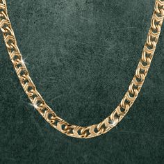 Designed to make an outstanding statement. Each necklace features a distinctive oval link design. Expertly crafted from stainless steel and lavishly finished in opulent yellow gold. Whether you’re attending a special occasion, making a fashion statement, or simply looking to elevate your everyday style, this men’s necklace is the epitome of luxury and distinction. Luxury Modern Gold-tone Chain Necklace, Luxury Oval Link Gold-tone Chain Necklace, Luxury Gold-tone Polished Finish Necklace, Luxury Gold-tone Statement Chain Necklace, Luxury Gold-tone Brass Chain Necklace, Latest Jewellery, Signature Design, Link Necklace, Gold Finish