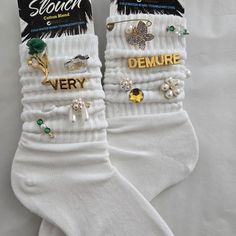 Charm, Junk, And Glam Socks Size: Adults 9-11 Color: White Add A Unique And Stylish Touch To Your Outfit With These Handcrafted, One-Of-A-Kind Slouch Socks! Featuring Elegant Charms Such As Pearl Accents, Rhinestones, And Delicate Gold-Plated Details, These Socks Combine Vintage Flair With Modern Charm. Gold Charms With “Very” And “Demure” Lettering Pearl And Crystal Flower Details Elegant Green And Gold Accents Soft, Comfortable Cotton Blend Material Perfect For A Casual Chic Or Playful Look Th Charm Socks, Slouch Socks Outfit, Bling Socks, Diy Fashion Projects, Embroidered Socks, Bling Shirts, Slouch Socks, Diy Socks, Cute Beanies