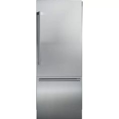 a stainless steel refrigerator freezer sitting on top of a white wall