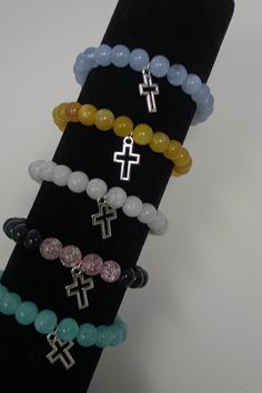 Simplistic, cross charmed bracelets that completely suit any outfit or can be used as a religious symbol Adjustable Everyday Rosary Bracelet With Cross, Adjustable Cross Rosary Bracelet For Everyday, Spiritual Cross Bracelets For Everyday, Sherman Moore, Religious Symbols, Cross Charms, United Kingdom, Jewelry Bracelets, Charm Bracelet