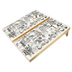 two white cornhole boards with black and white images on them