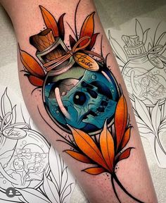 a tattoo with an image of a skull in a bottle and leaves on the leg