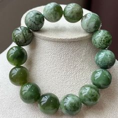 material:Green jade beads size Approx :15mm If you need other sizes, please feel free to contact me, thank you！ See all of our beads: https://www.etsy.com/shop/Nextjewelry?ref=hdr_shop_menu Green Beaded Bracelets With Large Beads, Polished Jade Beaded Bracelets, Jade Bracelets With Polished Beads, Jade Bracelets With Polished Round Beads, Green Gemstone Beads Round Bracelets, Green Gemstone Beads Round Bracelet, Green Polished Beaded Bracelets, Jade Beads, Green Jade