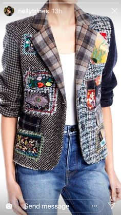 a woman is wearing a jacket with patches on it