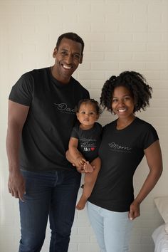 Show Off Your Family Style! Introducing our special and meaningful t-shirt designs for the whole family! Our matching mother, father, and baby tees are the perfect way to showcase your love and connection. 👚 Mother's T-Shirt: Featuring the design "A Heart Full of Empathy," this shirt reflects the loving nature of mothers. Available in black, white, and blue, it's a perfect piece for any occasion with its comfortable and stylish fit. 👕 Father's T-Shirt: The "A Protective Shield" design highligh Mother Father And Baby, Mom Dad And Baby, Family Unity, Message Mom, Dad And Baby, Papa T Shirt, Father And Baby, Matching Mom, Baby Tees