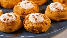 a blue plate topped with mini pumpkin pies