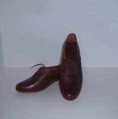 Vintage Town & Country classic brown spectator tie oxford shoes.  Deadstock.  Never worn.  Women's size 8.5  MEDIUM.  Heel height-1.5".  Made in Brazil. Classic Brown Closed Toe Lace-up Shoes, Brown Oxfords With Rubber Sole And Almond Toe, Brown Oxfords With Almond Toe And Rubber Sole, Brown Almond Toe Oxfords With Rubber Sole, Classic Brown Oxfords With Round Toe, Vintage Brown Lace-up Business Shoes, Brown Oxfords With Leather Sole And Almond Toe, Classic Brown Loafers, Brown Lace-up Loafers With Brogue Detailing