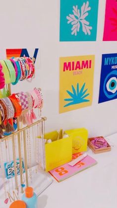 there are many bracelets on display in this room and one is hanging from the wall